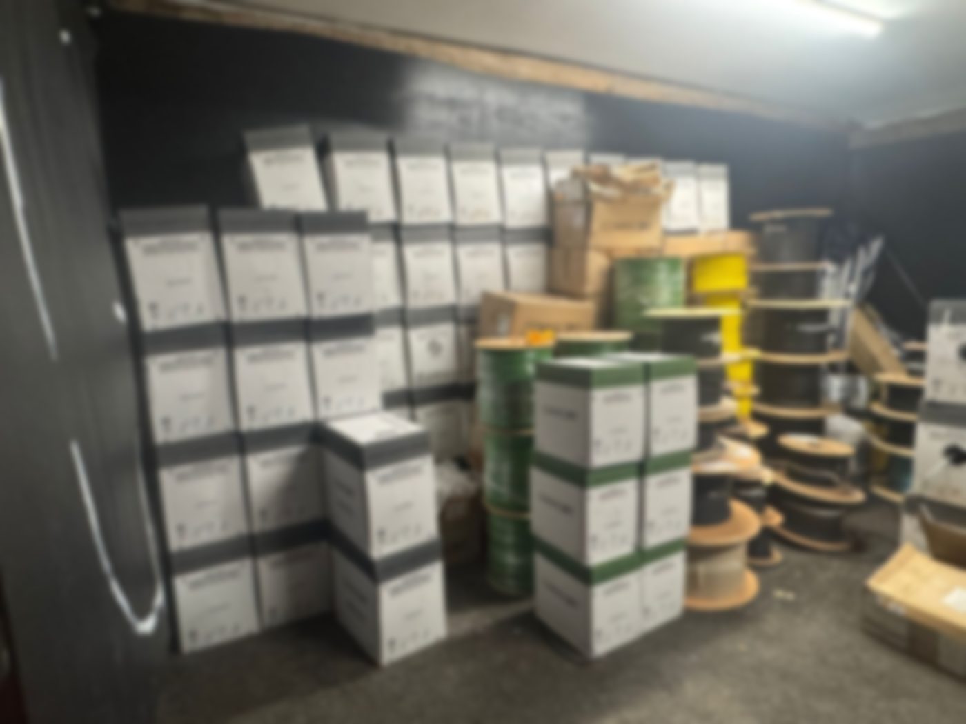 A single photo of mixed stock stacked in a storeroom, the only detail supplied with the offer